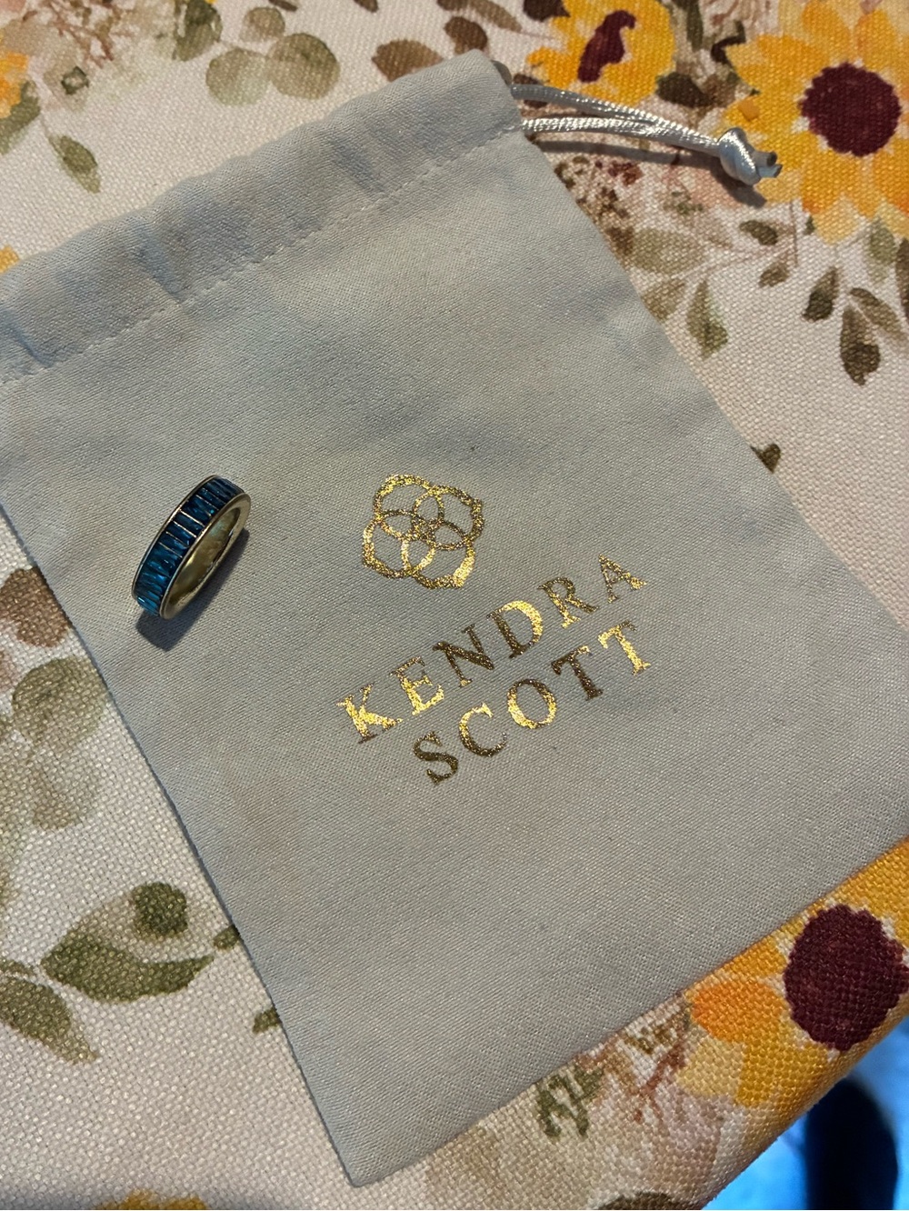 Ring on branded pouch